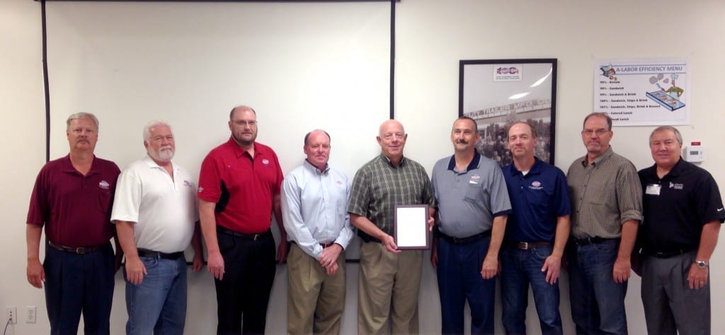 Clearfield, Utah manufacturing plant management team accepting the Liberty Mutual Safety Award