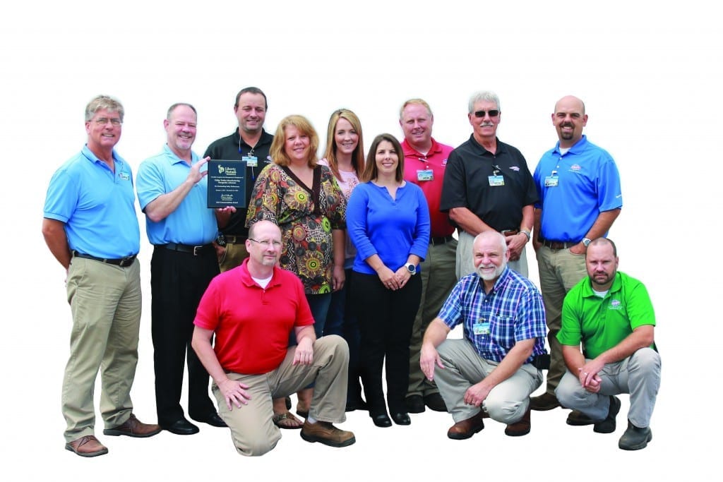 Standing - Left to right: David Neighbors, Dale Innis of Liberty Mutual, Bobby Wilson, Hope Lutrell, Mary Pierce, Rachell Boudreau, John Oliver, Jim Rison and Jeremy Dogan. Kneeling - Left to right: Sean Graddy, Scott Maxwell and Joe Upchurch